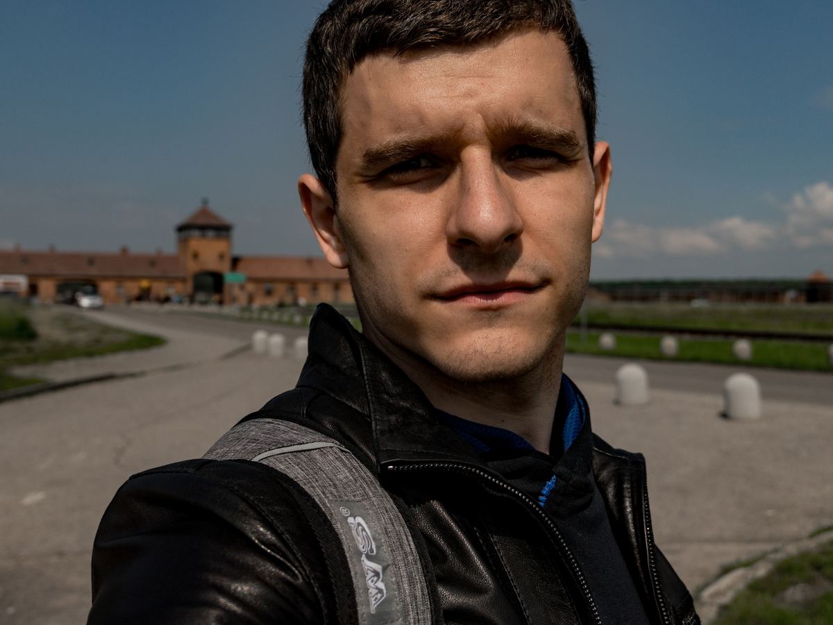 Maxim Chornyi at the main gate of Auschwitz-Birkenau