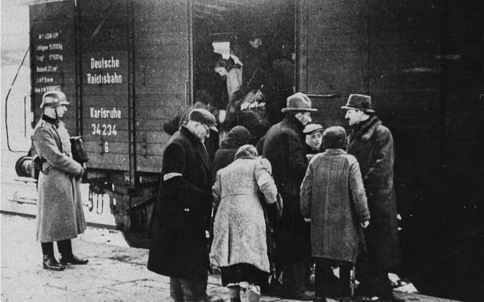 A member of the German SS supervises the boarding of Jews onto trains during a deportation action in the Krakow ghetto. 2