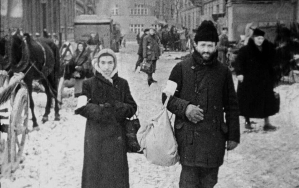 Jewish man with winter hat and star armband in the Krakow ghetto