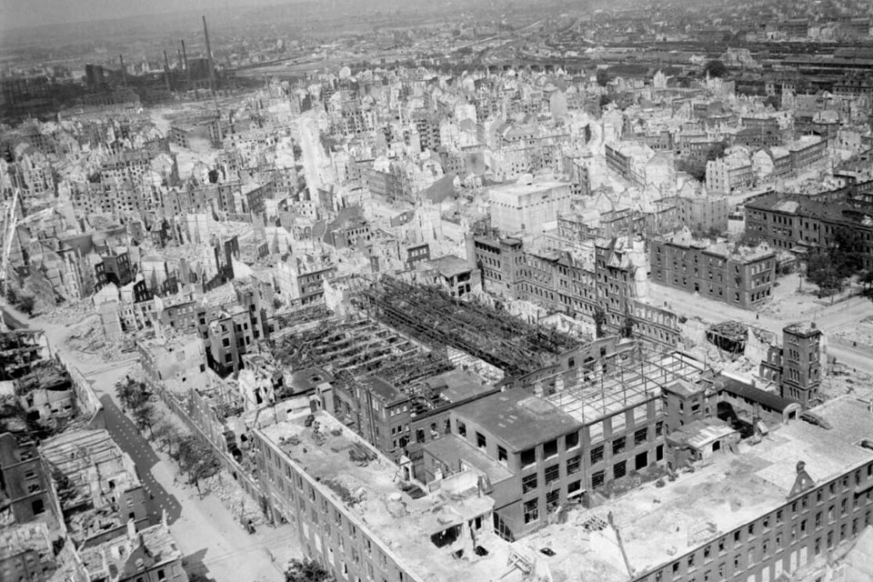 Oblique aerial view of heavily-damaged industrial and residential buildings in Nuremberg
