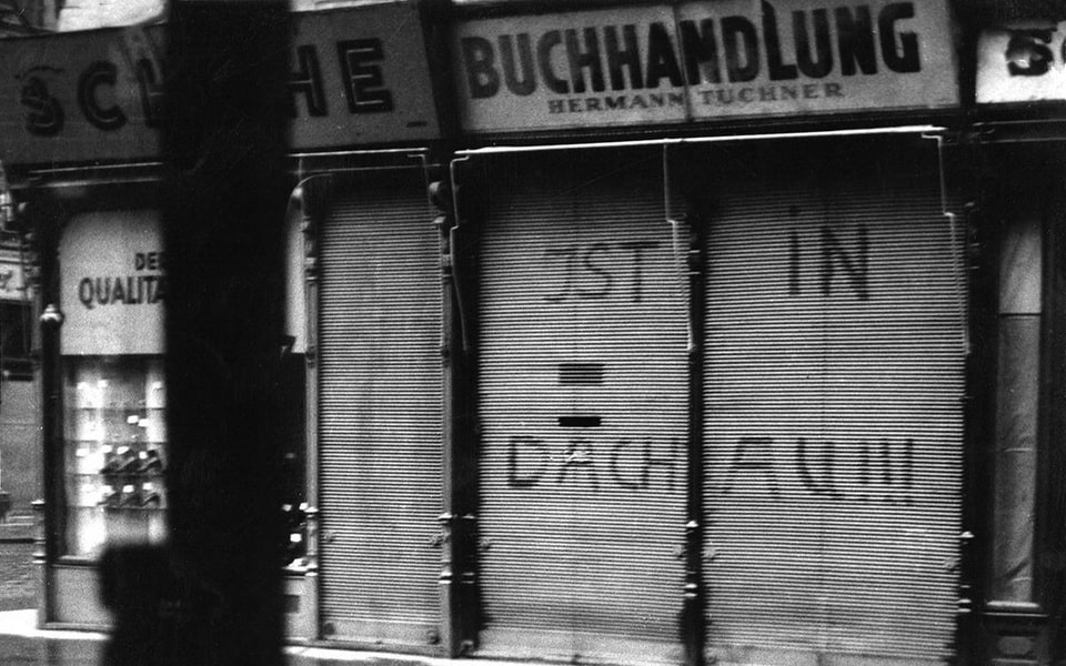 Inscription «Nach Dachau!!!» (To Dachau!) defaced on a Jewish-owned bookstore in Vienna, March 1938 after the Anschluss