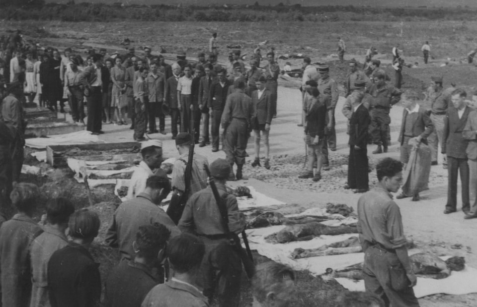 Civilians brought to witness the horrors of the Dachau concentration camp after liberation, May 1945