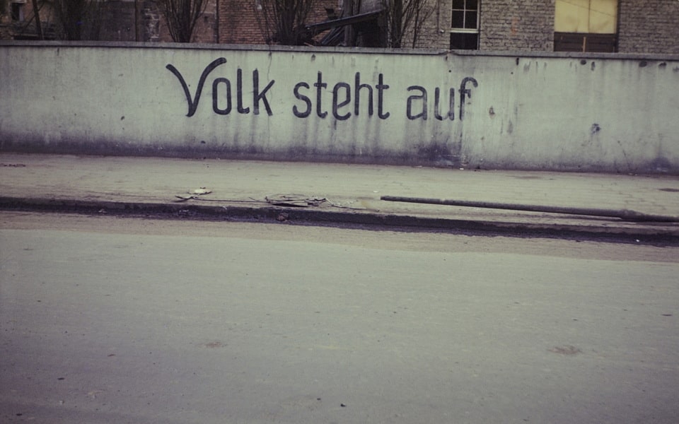 German propaganda inscription «Volk steh auf» (People, rise) on a building in the town of Dachau, 1945