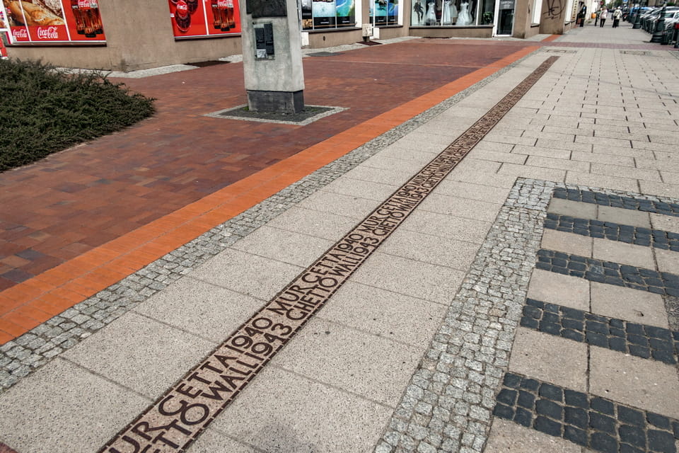 Warsaw ghetto boundaries signs in pavement