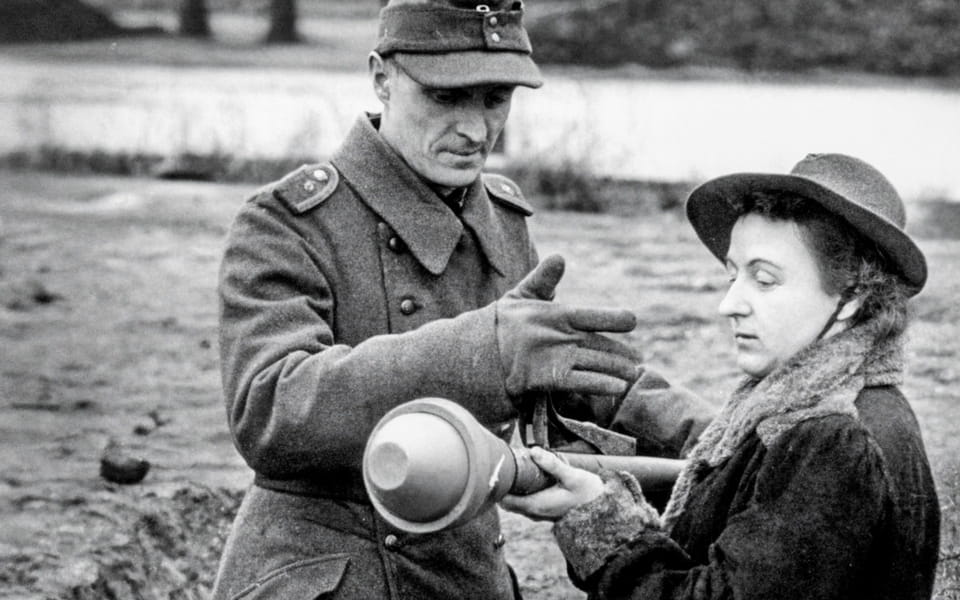 Berlin, march 1945 a woman is taught how to use panzerfaust