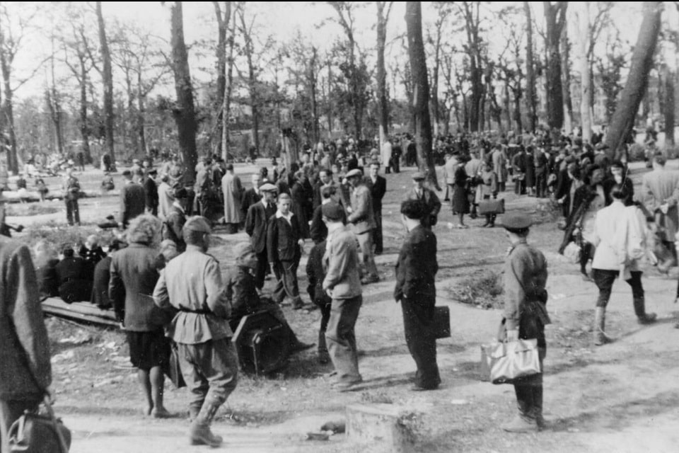 People milling about at the black market in the Tiergarten, Berlin