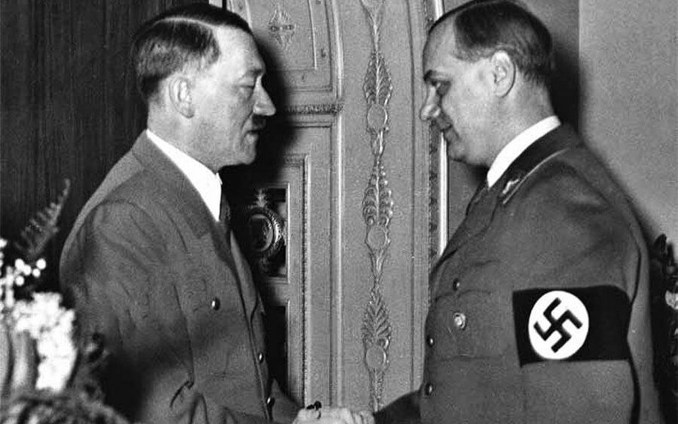 Adolf Hitler and Alfred Rosenberg at a Nazi rally, c. 1930s — Rosenberg was one of Hitler's earliest ideological mentors in the NSDAP