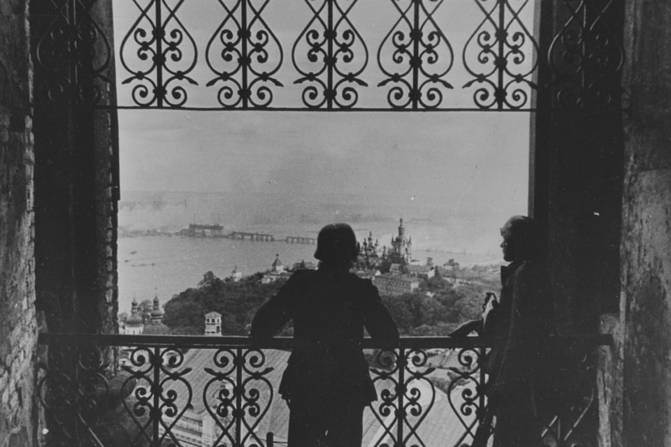 Two German soldiers look at Kyiv from the bell tower of the Kiev Pechersk Lavra