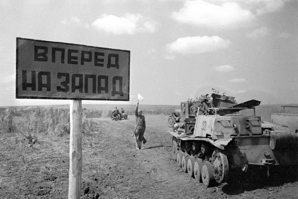 Soviet traffic controller at work near a Wehrmacht engineering vehicle (based on the Pz.Kpfw. II tank) 1943