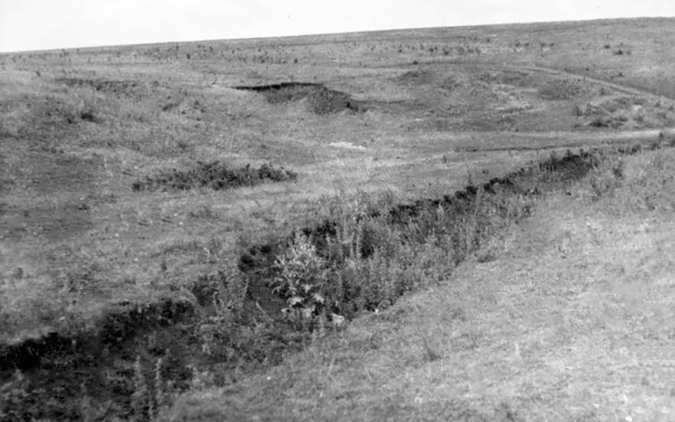 the post war photo of the site of mass execution near Kharkiv