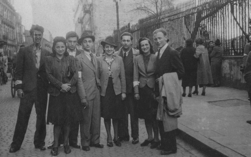 A group of Jewish young adults pose on a street in Warsaw_
