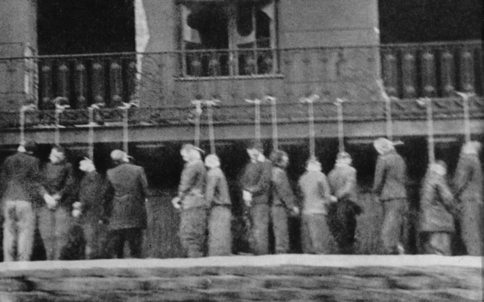 An execution of 27 Pawiak prisoners, executed by hanging from the balcony of a house on Leszno St. 27, on February 11, 1944.