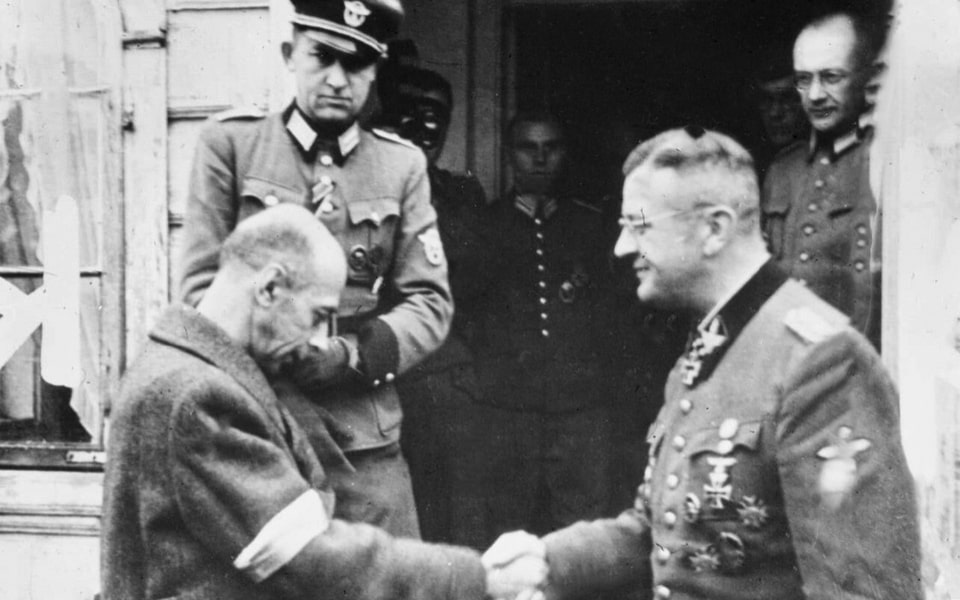 Carefully orchestrated German propaganda film still of General Tadeusz Bór-Komorowski, the C-in-C of the Polish Home Army, shaking hands with SS-Obergruppenführer Erich von dem Bach-Zelewski