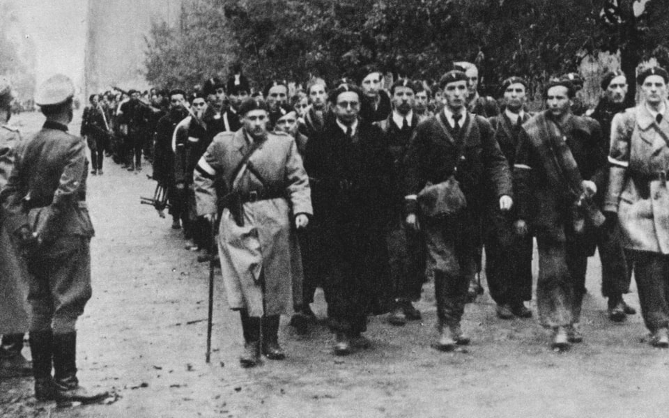 Soldiers of the Home Army surrendering to the German Wehrmacht at the checkpoint in Warsaw, 5 October 1944.