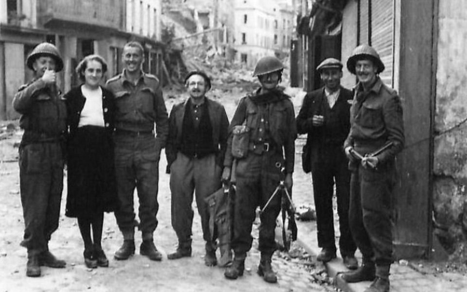 French civilians who remained on in Caen cordially greeted our 3rd Division troops