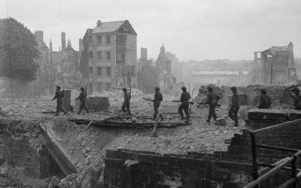 July 10, 1944 British sappers advance through the ruins of the city of Caen, where numerous explosive booby traps have been left by the Germans