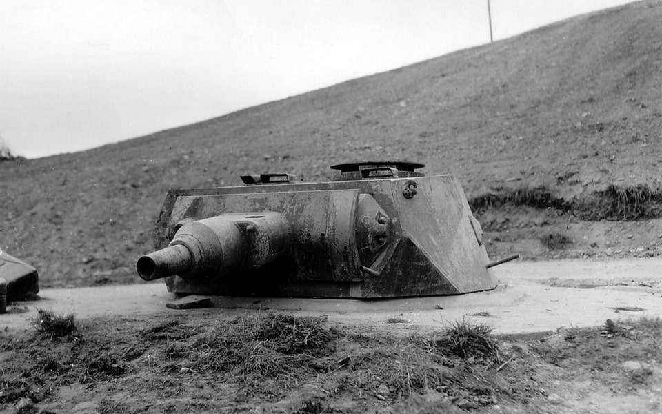 German PzKpfw IV tank turret embedded as bunker at Omaha Beach — Atlantic Wall firing point, Normandy 1944