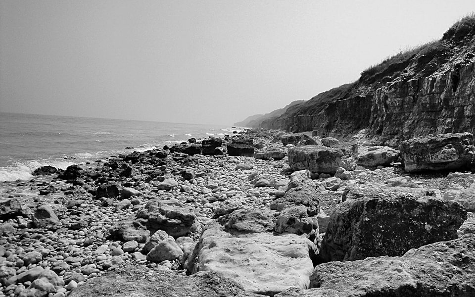 Fox Green and Fox Red cliffs on Omaha Beach today — modern view of terrain where 1st Infantry Division took cover on D-Day