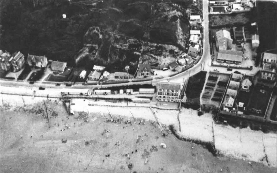 Aerial reconnaissance photo of Vierville-sur-Mer, 1939 — five years before Allied D-Day landing below these cliffs