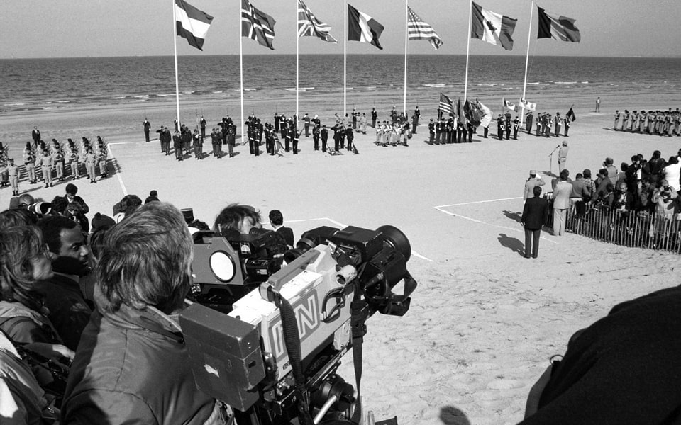 Crowds of people gather at Omaha Beach for a ceremony commemorating the 40th anniversary of D-day, the invasion of Europe 1984