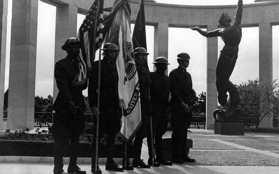 The 1st Inf Div. Honor Guard stands at attention at the Omaha Beach Military Cemetery Monument commemorating the 30th Anniversary of the D-Day Invasion of Normandy, on June 6, 1944. 1974