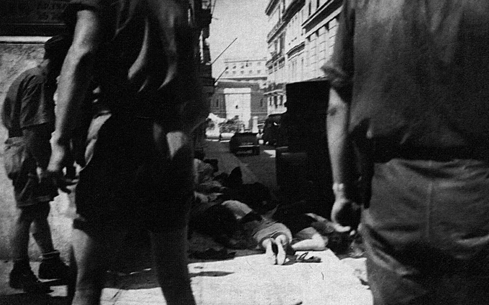 A rare photograph of the bodies of the victims after the July protest