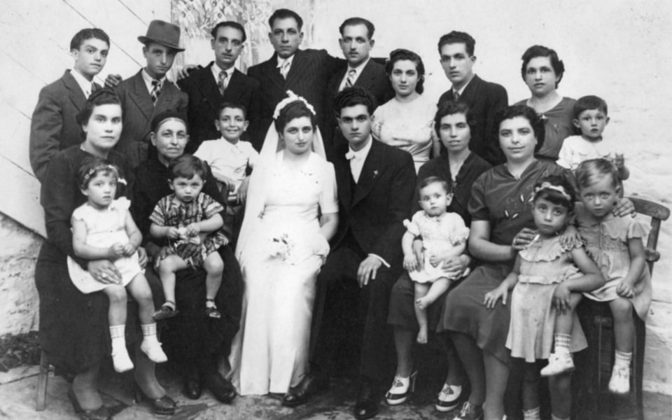 Wedding portrait of an extended Jewish family in Greece. 1941-1942