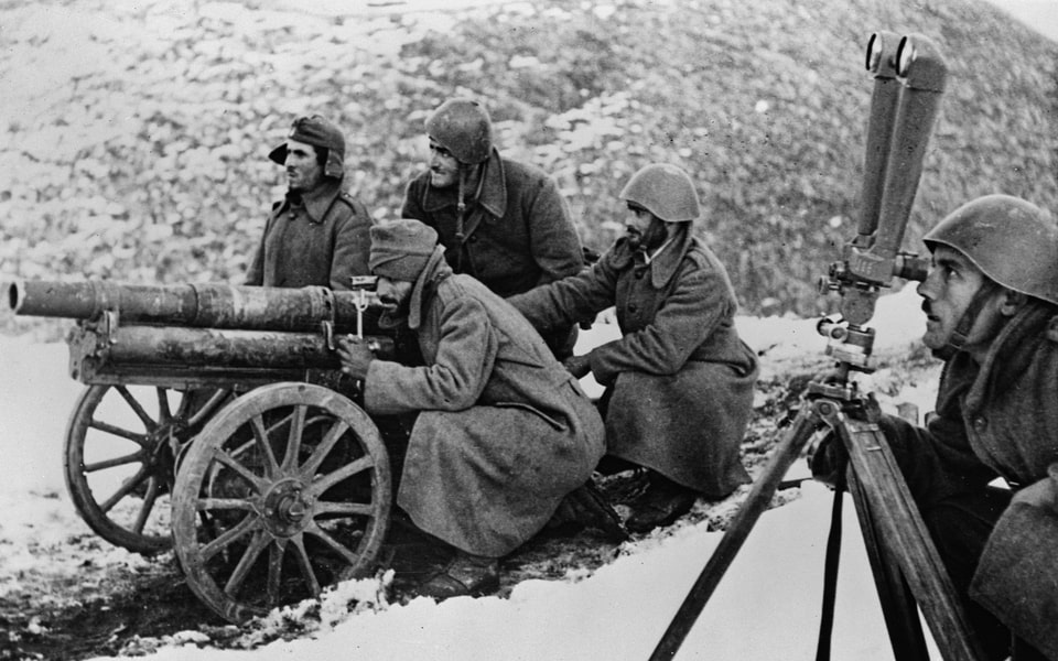 Greek gunners fire the mountain version of the French 65mm gun (Canon de 65M Mle1906 L18.5) in the mountains during the war with Italy in the winter of 1940-41. Greece in WW2