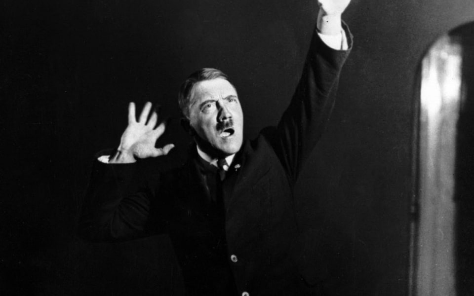Adolf Hitler rehearsing his oratory in a mirror in 1925. Captured by his photographer Heinrich Hoffmann 2