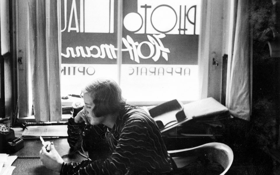 Eva Braun posing on a desk in Heinrich Hoffmann’s atelier in the office at Amalienstrasse in 1930