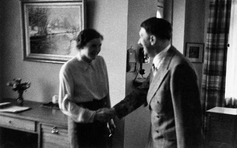 Heinrich Hoffmann showing Hitler some new interesting photo collection, 1st July 1939. Gretl Braun, Eva's sister meets him