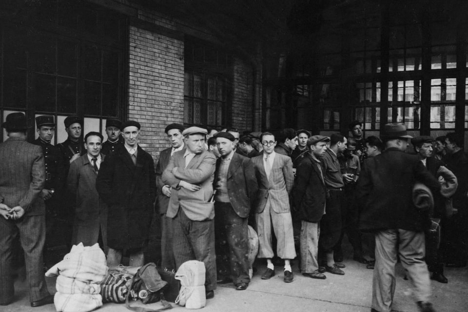 French police escort Jewish men to deportation trains at the Austerlitz station