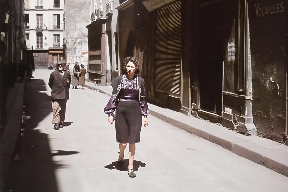 On the Rue des Rosiers in occupied Paris. The man in the background has a yellow star on his chest