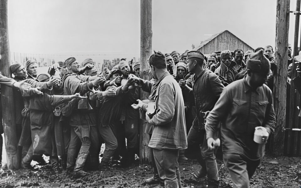 Soviet POWs hand out bread in the camp at Vinnitsa