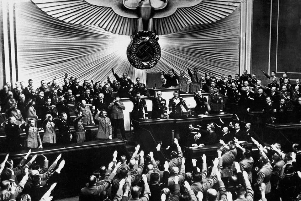 The Reichstag cheers Hitler's announcement of the annexation of Austria, March 12, 1938.