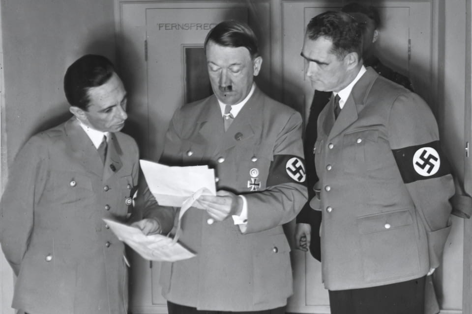 Adolf Hitler reviews the results of the plebiscite for Austria with Joseph Goebbels and Rudolf Hess April 10 1938