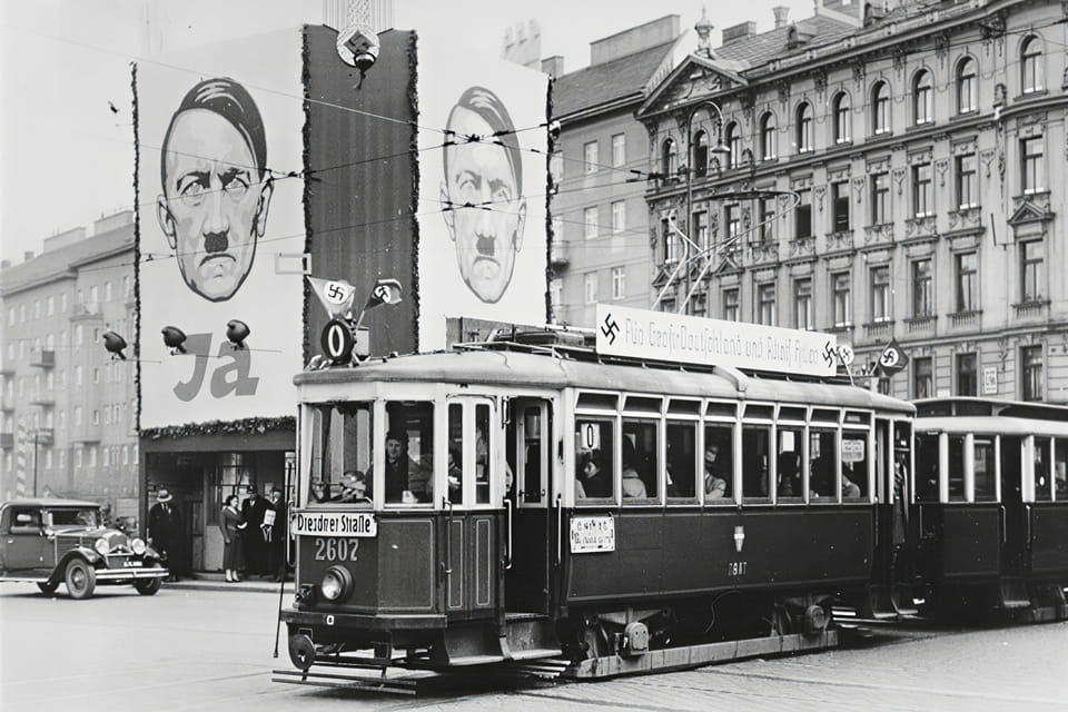Nazi campaign placards covering shopfronts in Austria, spring 1938