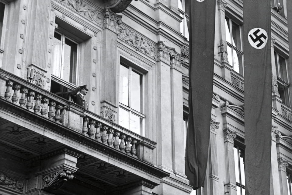 Adolf Hitler greets the crowd from the balcony of Hotel Imperial in Vienna 9 April