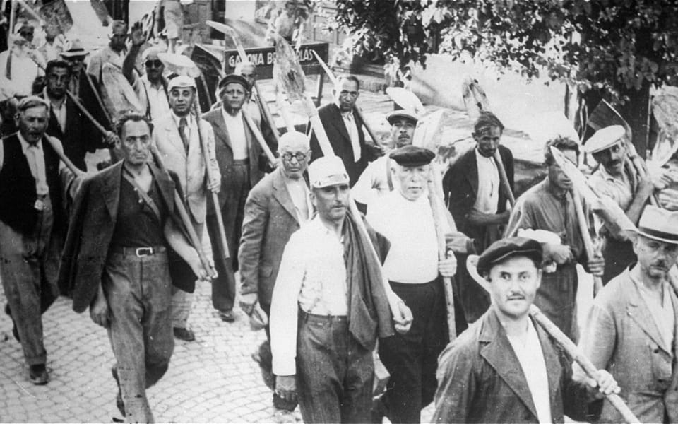 Jews drafted into the Hungarian Labor Service System march to a work site