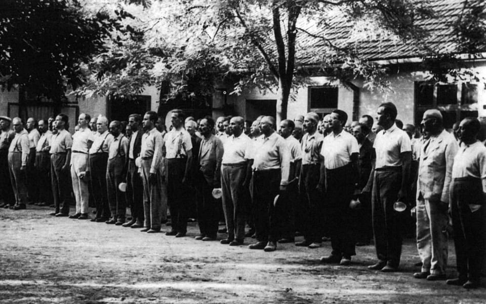 Members of a Jewish Hungarian labor service unit lined up waiting to be fed, Abony, Hungary, 1940