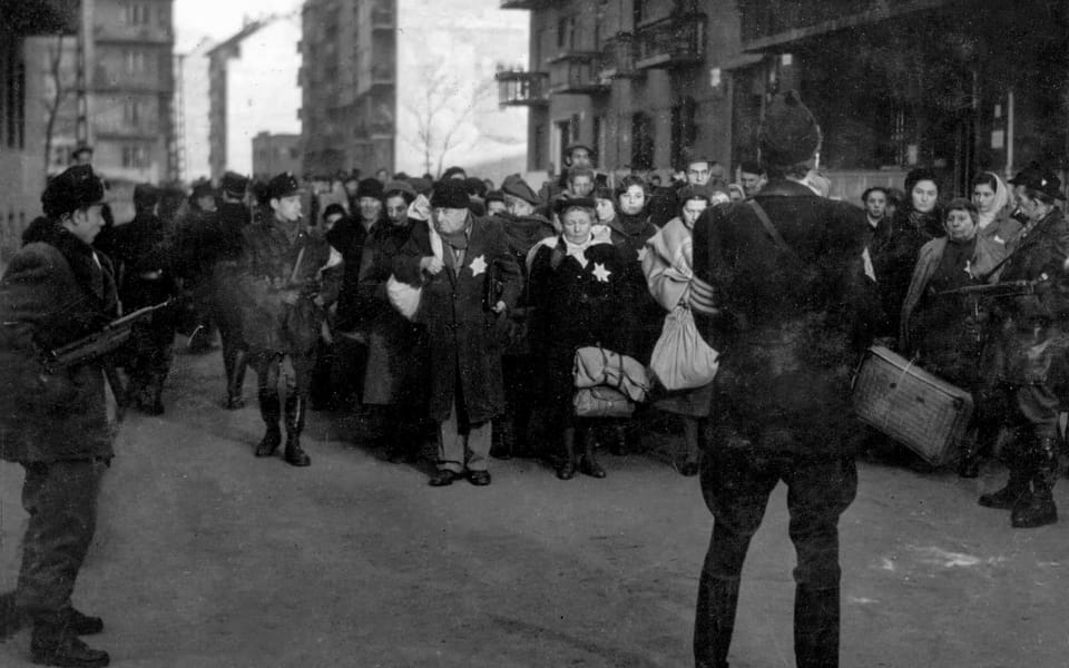 Arrow Cross militiamen rounding up a group of Budapest Jews, 1944