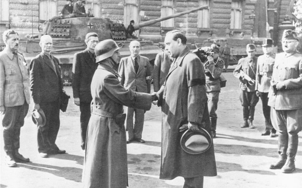 The new premier of Hungary, Arrow Cross party leader Ferenc Szalasi, greets his troop commander in front of the Ministry of Defense in Budapest