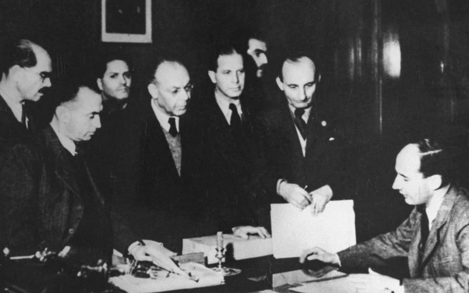 Raoul Wallenberg in his Budapest office with his Jewish co-workers