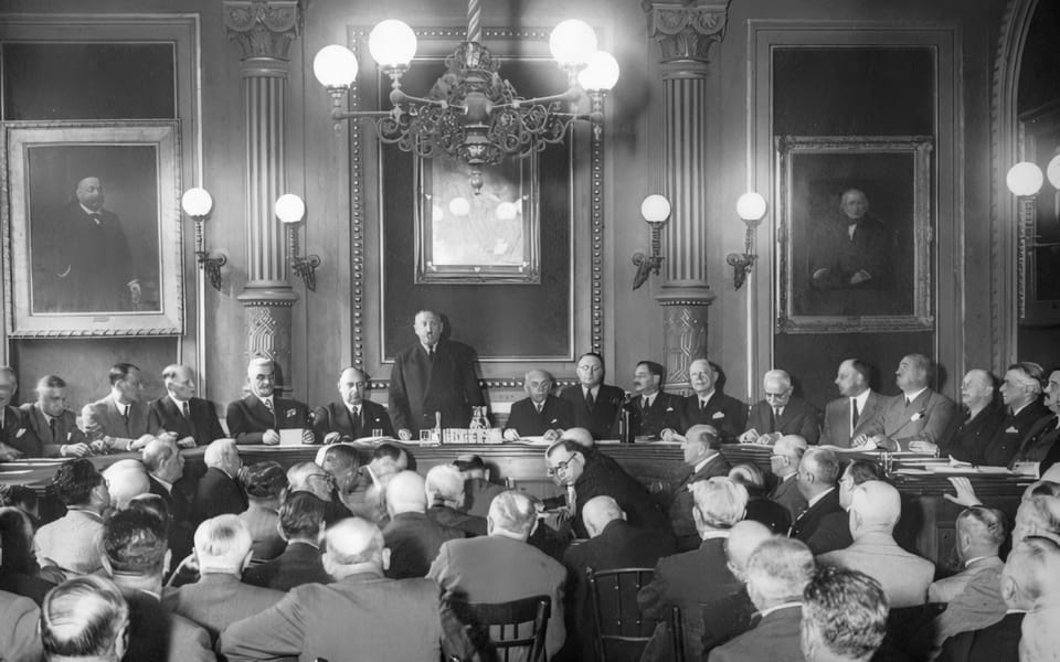 In the state room of their headquarters at 12 Síp Street, the Pest Israelite Congregation, representing Budapest’s Neolog Jews, is gathered here for its general assembly, circa 1937